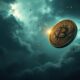 Bitcoin coin falling under dark stormy clouds.